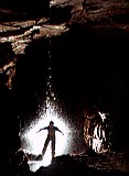 Tarquin in the waterfall in Gilwern Passage, Ogof Draenen. Flash by Adam Whitehead, camera by Ian Wilton-Jones, setup by Tarquin and Ian Wilton-Jones.
